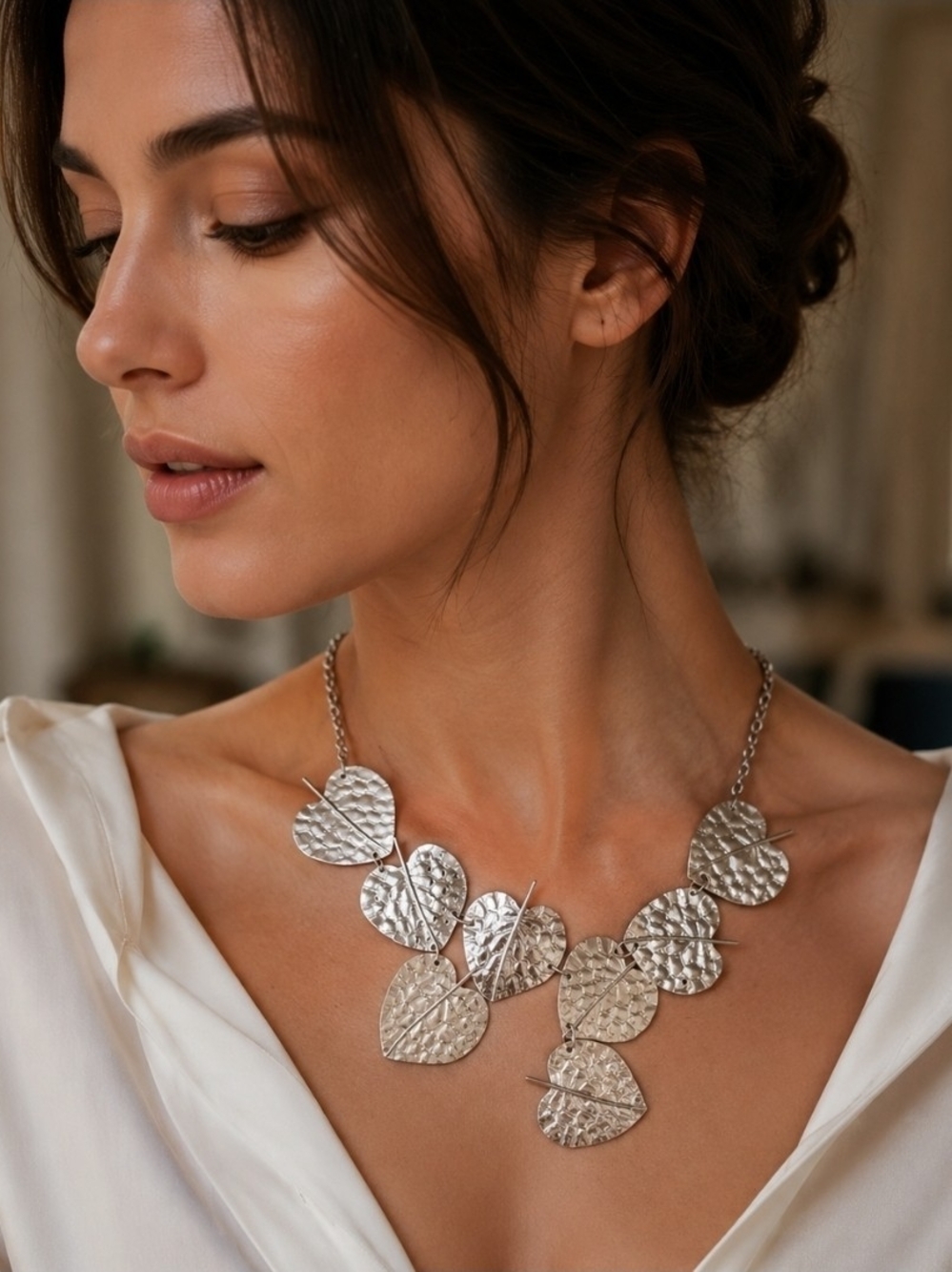 Silver Tone statement necklace with leaf shape